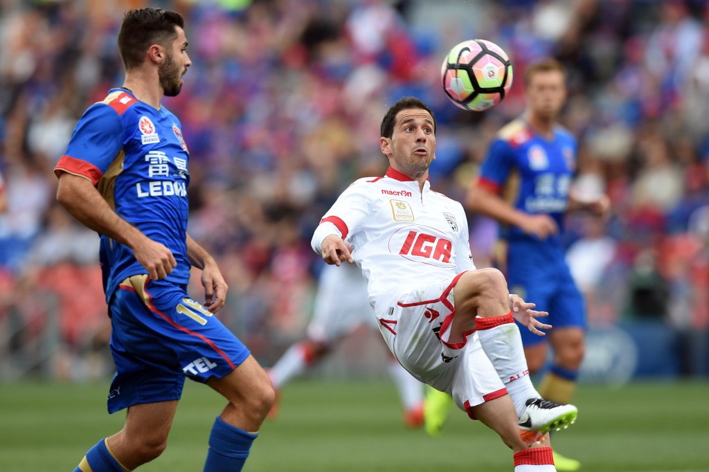 One of United's familiar faces, Sergio Cirio (centre), in action against the Jets. Photo: AAP/Paul Miller