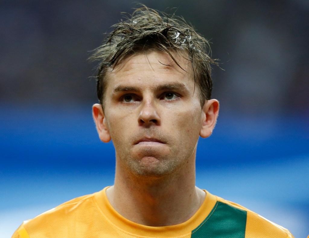 Brett Holman listens to the national anthem before a 2013 World Cup qualifier in Saitama, near Tokyo. Photo: Shuji Kajiyama / AP