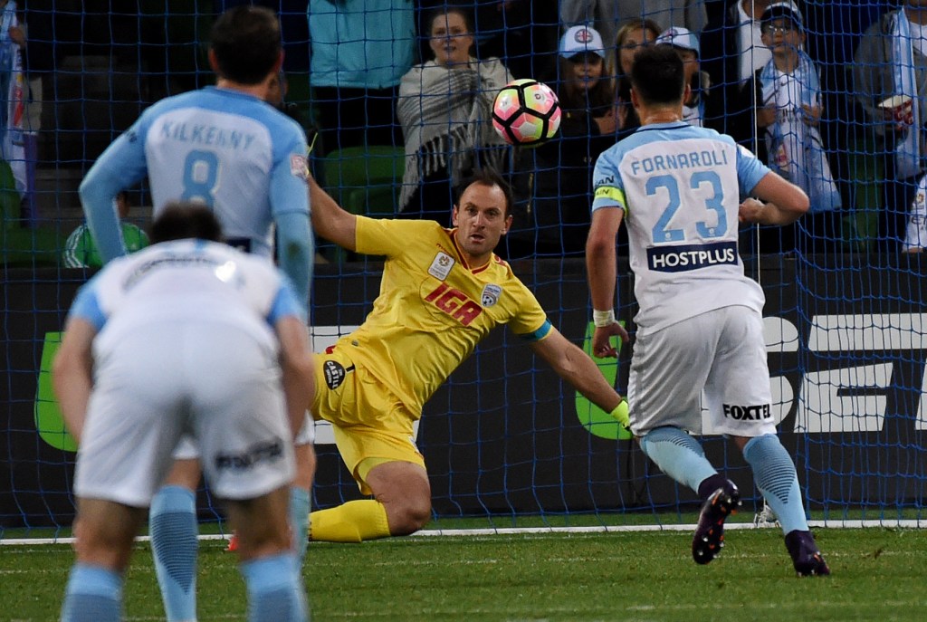 Eugene Galekovic defends as Bruno Fornaroli scores a goal in Adelaide's loss to Melbourne City. Photo: Tracey Nearmy / AAP
