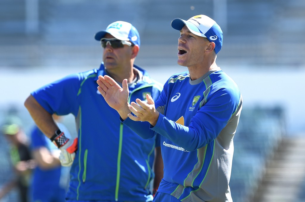 David Warner looks on with coach Darren Lehmann during the Australian team's training session at the WACA yesterday. Photo: Dave Hunt / AAP