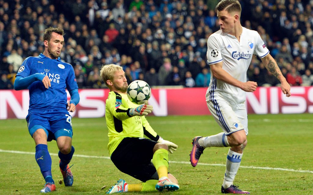Leicester City's goalkeeper Kasper Schmeichel and FC Copenhagen's Benjamin Verbic, right, battle for the ball during their Champions League fixture at Parken Stadium this morning. Photo: Jens Dresling / Polfoto via AP