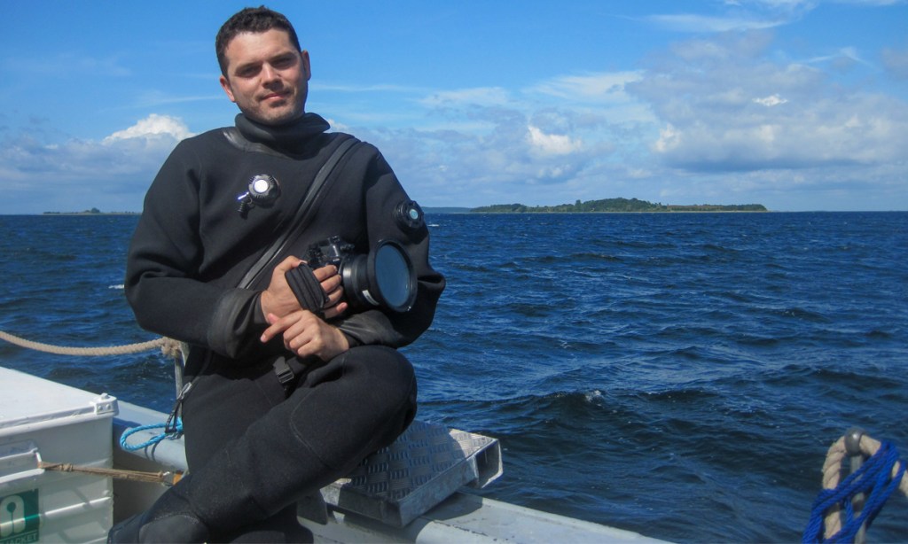 Archaeologist Dr Jonathan Benjamin prepares to record a submerged Mesolithic site in the shallow waters of Denmark, Baltic Sea. Photo courtesy John McCarthy (Flinders University).