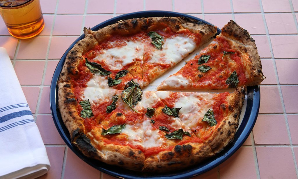 'Simple and elegant' - Sunny's tomato, mozzarella and basil pizza. Photo: Tony Lewis