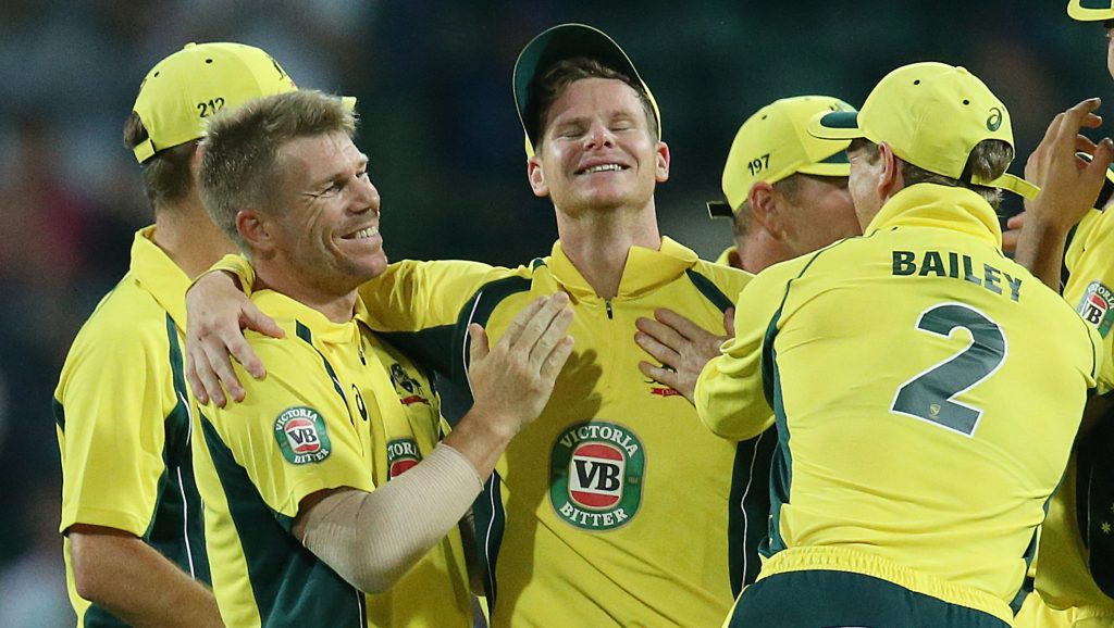 Teammates congratulate Steve Smith after his miraculous catch to dismiss New Zealand's BJ Watling. Photo: David Moir / AAP