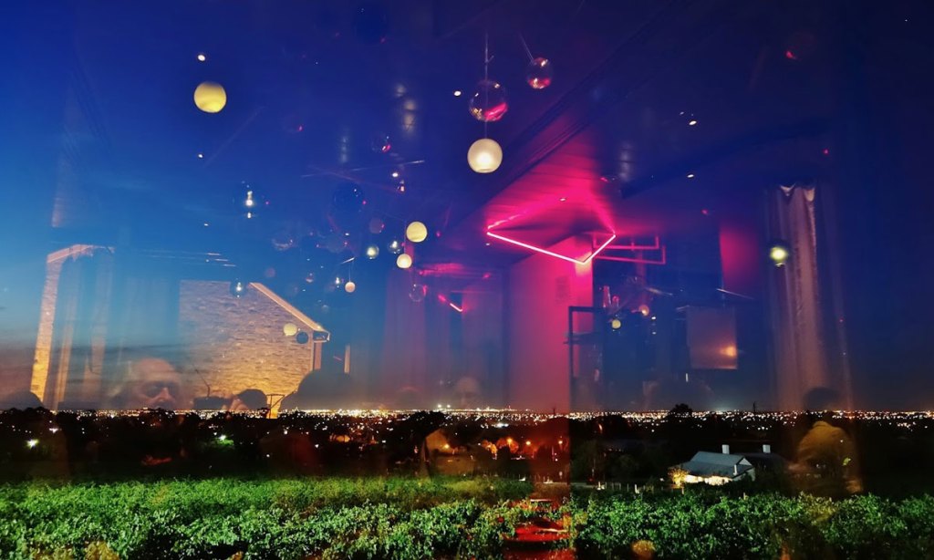 Heavenly lights over Adelaide: reflections in the window from Penfolds' Magill Estate restaurant. Photo: Philip White