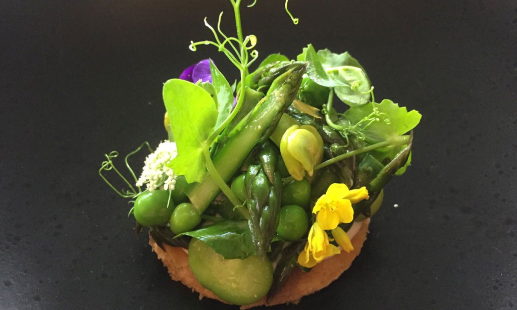 The Chef's Table will include dishes such as this spring vegetable tart with brassica flowers.