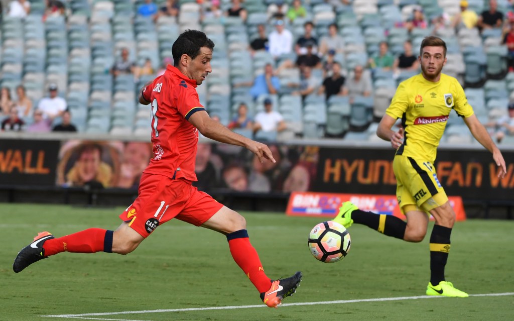 Sergio Cirio takes a shot during United's loss to Central Coast Mariners - a match, like last week's, played in extreme heat. Photo: Mick Tsikas / AAP