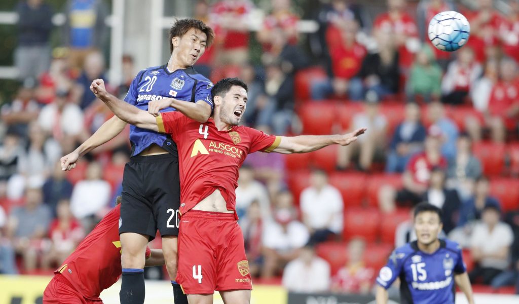 Gamba's Shun Nagasawa punishes Adelaide United with a first-half header. Photo: Kyodo via AAP