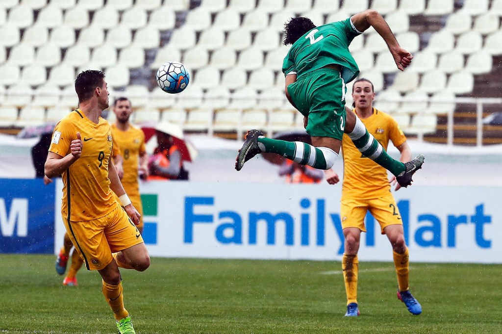 Iraq's Ahmed Ibrahim lunging for the ball ahead of Australia's Tomi Juric (left) as the sides played out a draw in their World Cup qualifier.  Photo: ABEDIN TAHERKENAREH / EPA