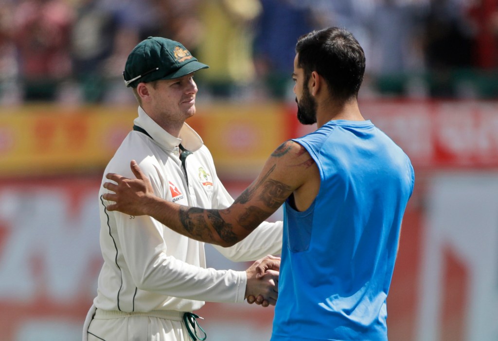 Steve Smith and Virat Kohli shake hands after India's series win yesterday. Photo: Tsering Topgyal / AP