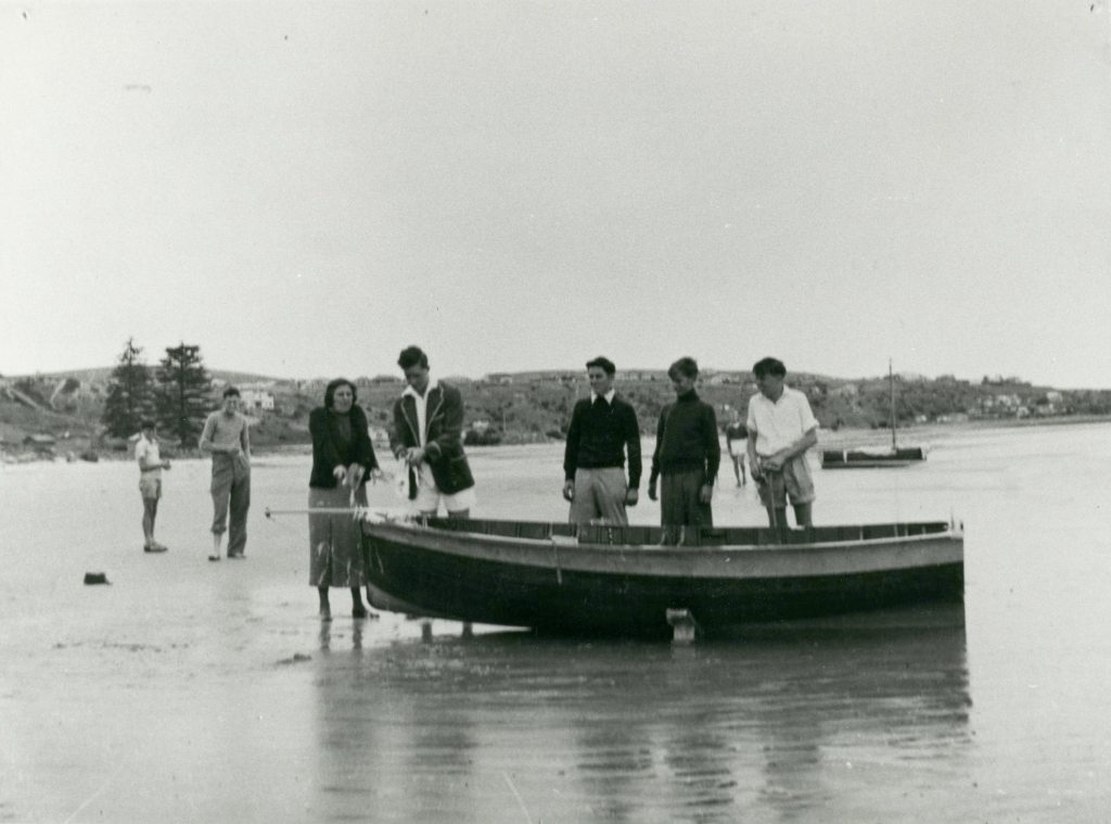 The naming ceremony at Brighton & Seacliff Yacht Club of Noc-too, the 12ft Cadet Dinghy Sir James built for Fred Neill c1953. Left to right: Florence (Flossy) Neill, Jim Hardy, John Neill, Rob Walker & Fred Neill. South Australian Maritime Museum Photographic Collection 16076