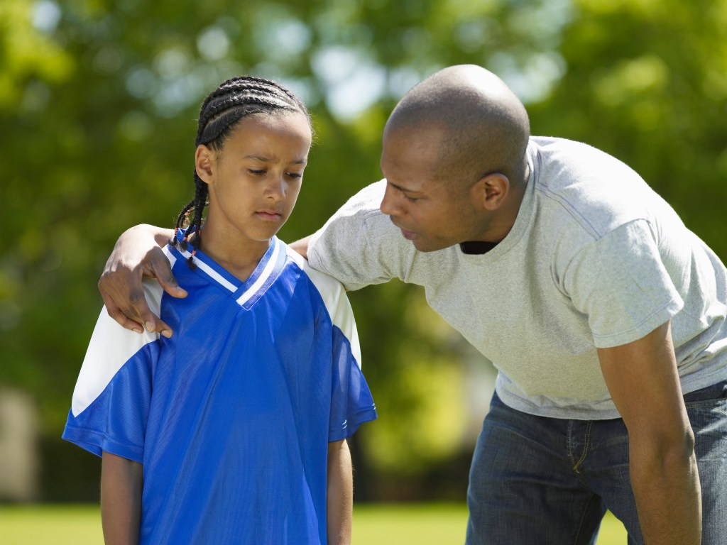 Father and Son Talking After Soccer Game
