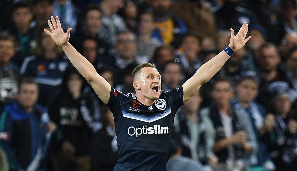 The Victory's Besart Berisha celebrates on the final whistle as his team defeats Brisbane Roar. Photo: AAP/Julian Smith