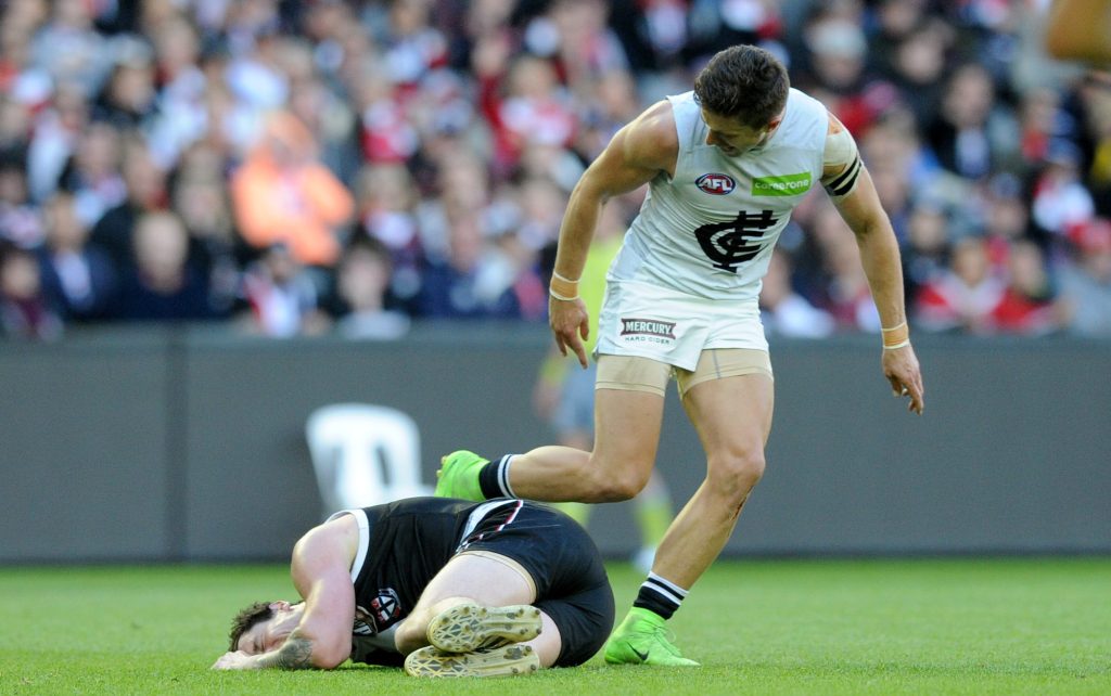 Marc Murphy yells at a prone Jake Carlisle amid the on-field sledging controversy. Photo: Joe Castro / AAP