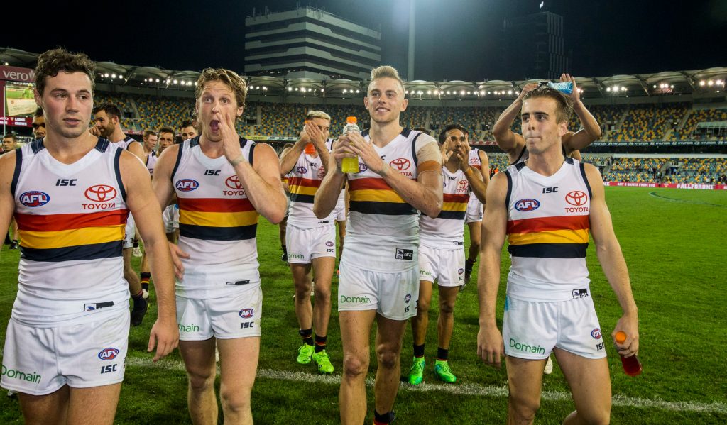 Debutants Jordan Gallucci (right) and Hugh Greenwood - Fumbles' new Favourite Person Ever - leave the field with milestone men Luke Brown and Rory Sloane after beating Brisbane. Photo: Glenn Hunt / AAP