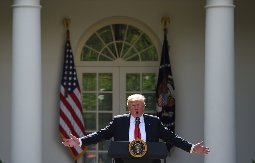 President Donald Trump, at the White House, announces that the US is withdrawing from the Paris climate accord. Photo: EPA/Molly Riley
