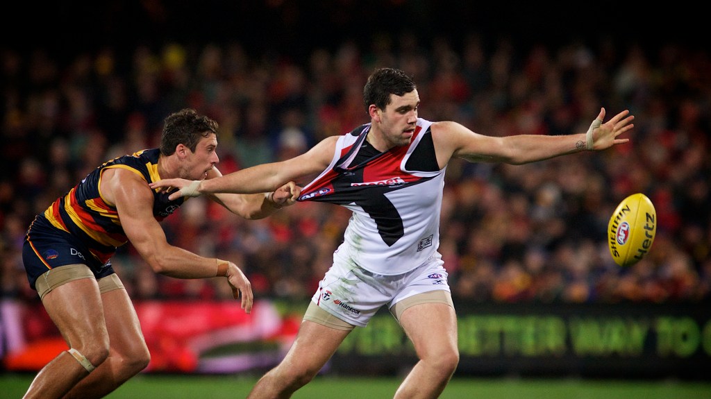 Kyle Hartigan gets a hold of Paddy McCartin's jumper on Friday night. Photo: Michael Errey / InDaily
