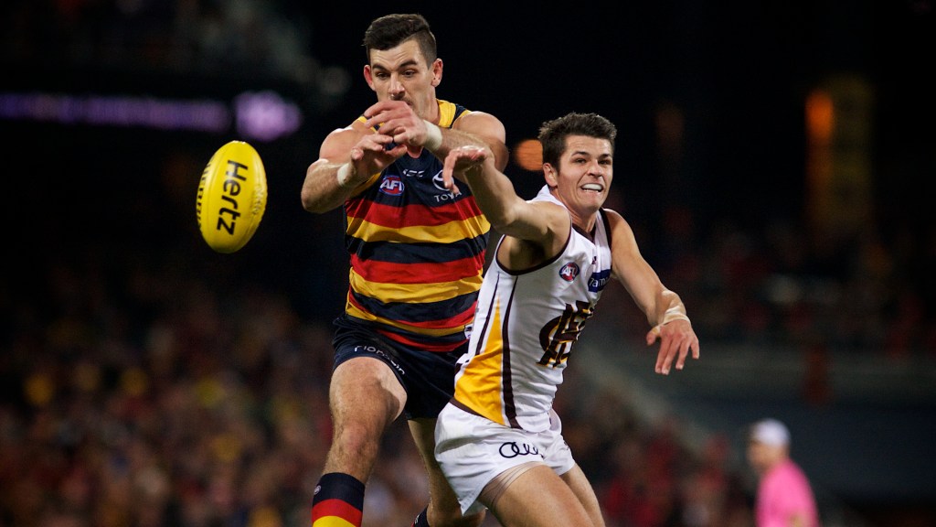 Taylor Walker tries to get hands to the ball. Fails. Photo: Michael Errey / InDaily