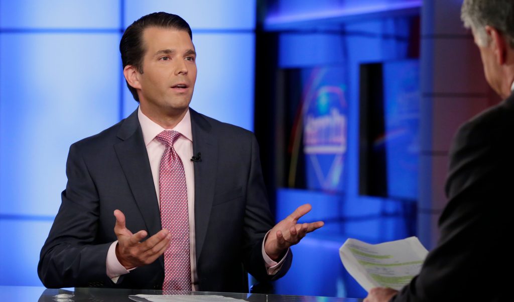 Donald Trump Jr., left, is interviewed by host Sean Hannity on his Fox News Channel television program. Photo: AP/Richard Drew