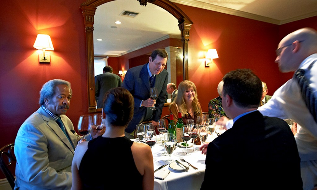Dr Bob hosting a Grange dinner with friends in New Orleans, with New Orleans songwriting piano king (and Grange lover) Allen Toussaint on the left. Photo: Milton Wordley, from A Year In The Life Of Grange