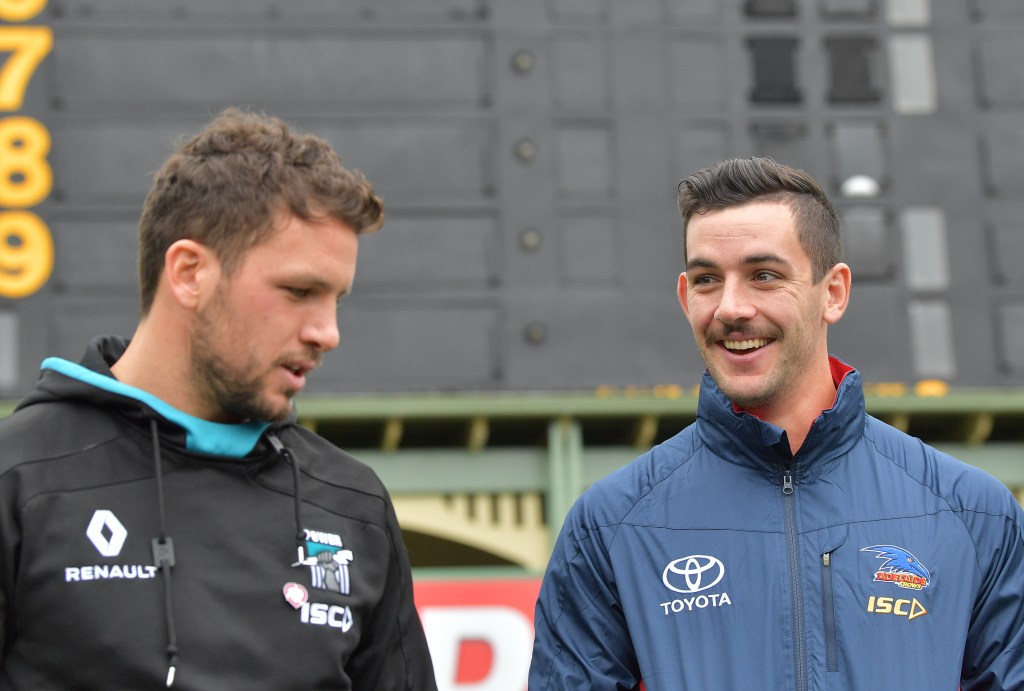 Port Adelaide captain Travis Boak and Crows skipper Taylor Walker speak to the media ahead of Sunday's Showdown. Photo: David Mariuz / AAP