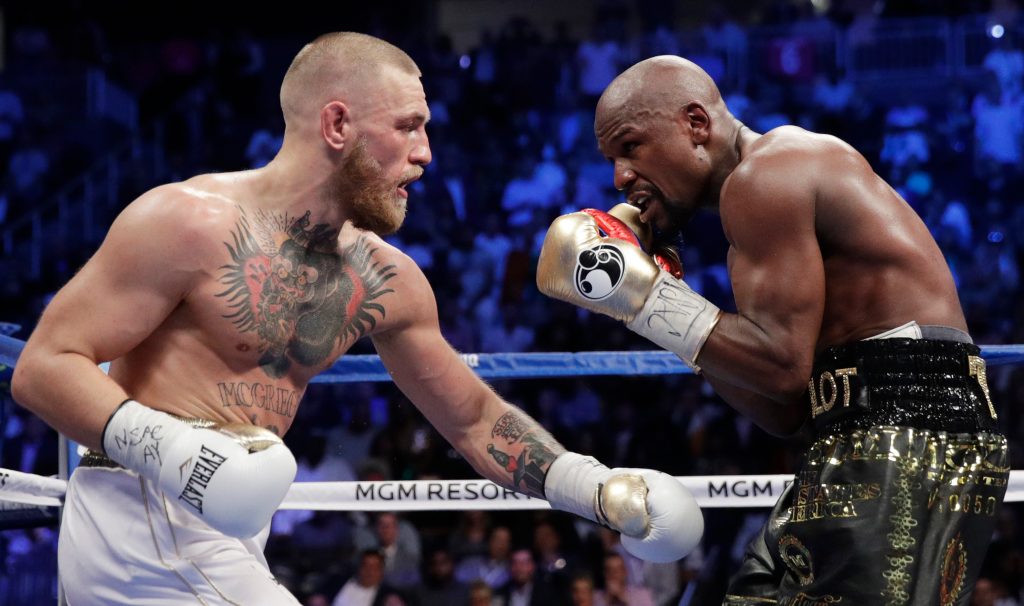 GET IN THE RING: Floyd Mayweather Jr. takes on Conor McGregor yesterday. Photo: Isaac Brekken / AP