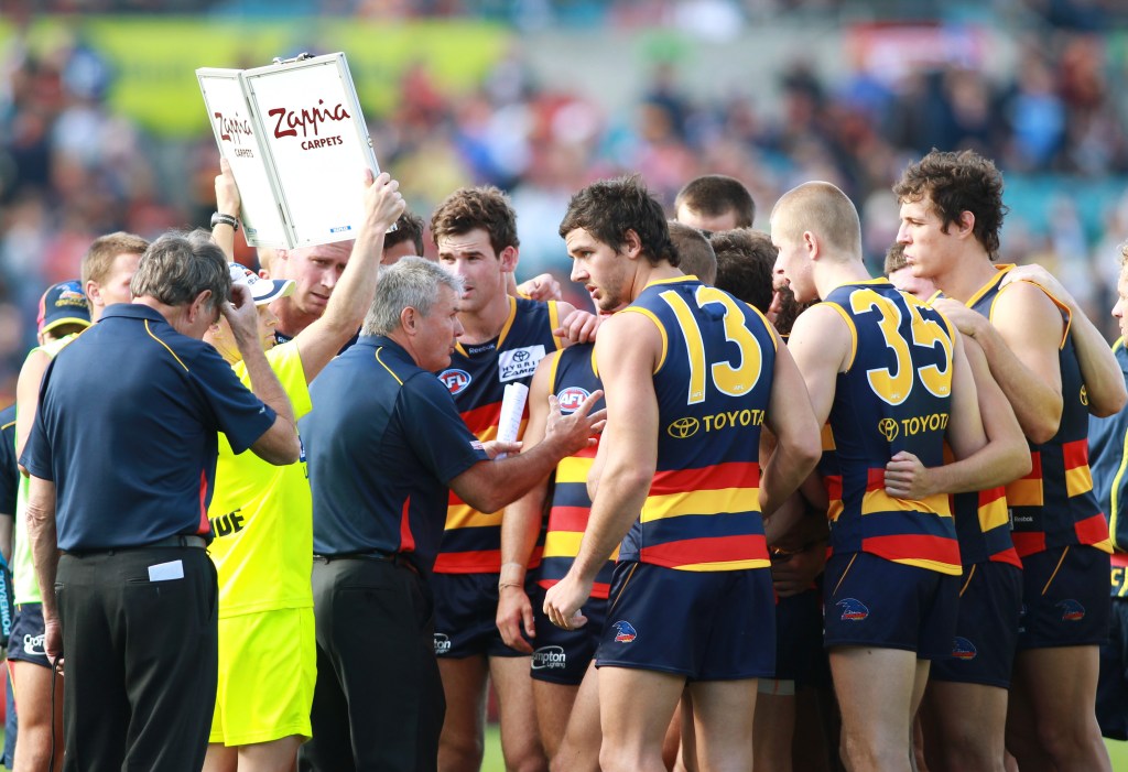 Neil Craig addresses a young Taylor Walker and teammates in 2011. He left the club later that season. Photo: Ben Macmahon / AAP