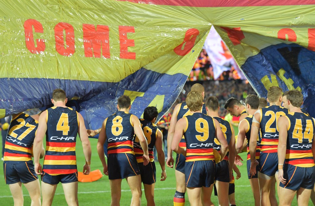 The Crows take the field to play the Cats earlier this year. Photo: David Mariuz / AAP