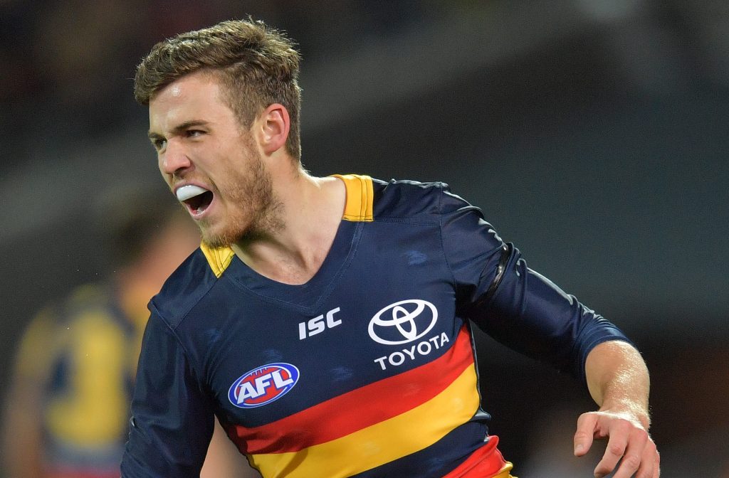 Rolling his sleeves up: Paul Seedsman in action against the Giants. Photo: David Mariuz / AAP