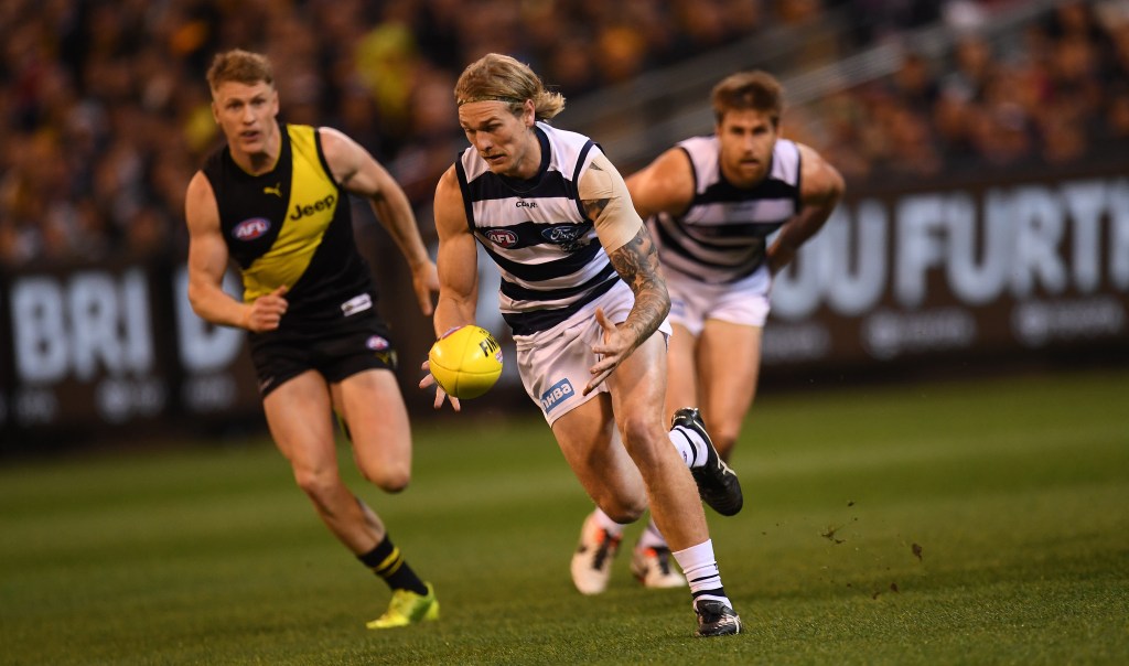 Tom Stewart (centre) is the latest Geelong defender to fall ill. Photo: AAP/Julian Smith