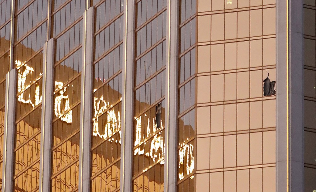 Broken windows seen on a high floor in the Mandalay Bay hotel facing the scene of the mass shooting. Photo: EPA/Paul Buck