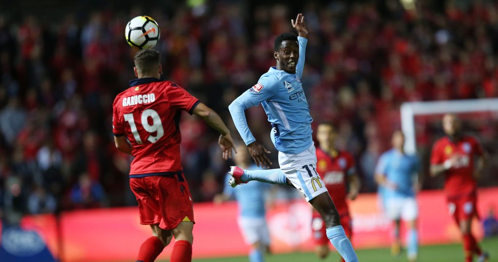 Ben Garuccio faces off against Bruce Kamau - lately of Melbourne City FC - on Saturday night. Photo: James Elsby / AAP