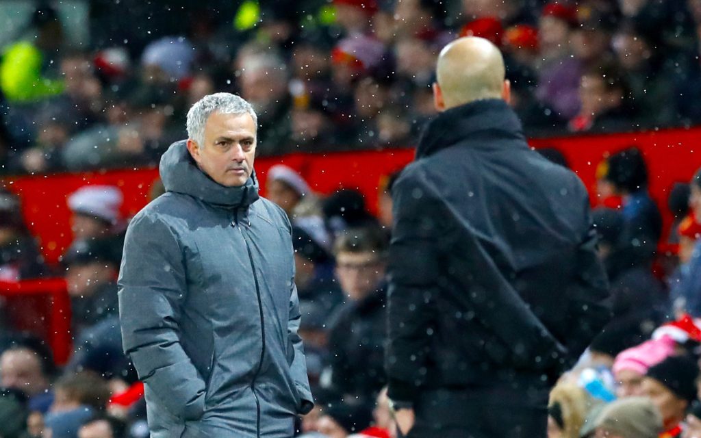 Manchester United manager Jose Mourinho City boss Pep Guardiola cross paths on the touchline. Photo: Martin Rickett / PA Wire