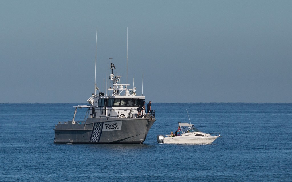 Police divers search for the missing teenage girl off  Glenelg Beach earlier today. Photo: AAP/Ben Macmahon