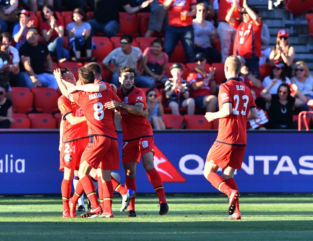 United players celebrate a goal against Perth Glory on the weekend. Photo: AAP/David Mariuz