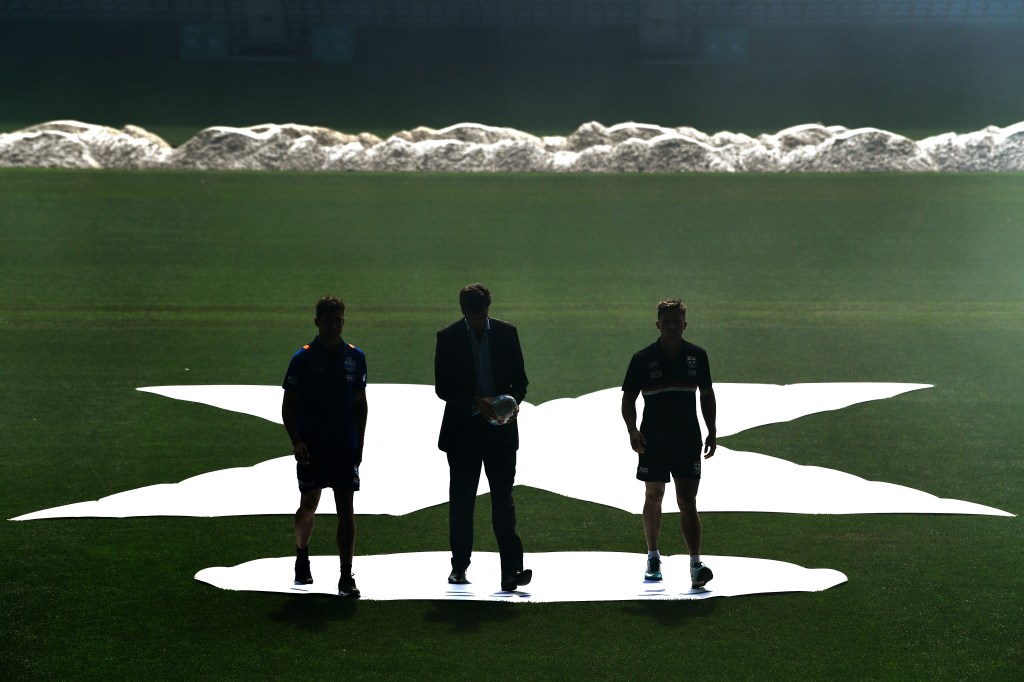 Left to right: North Melbourne player Shaun Atley, AFL chief executive Gillon McLachlan, and St Kilda player Jack Billings at the AFLX season launch at Etihad Stadium. Photo: AAP/Joe Castro