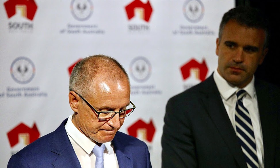 Jay Weatherill, flanked by Health Minister Peter Malinauskas, delivers an apology to Oakden victims following the release of the ICAC report. Photo: Tony Lewis / InDaily