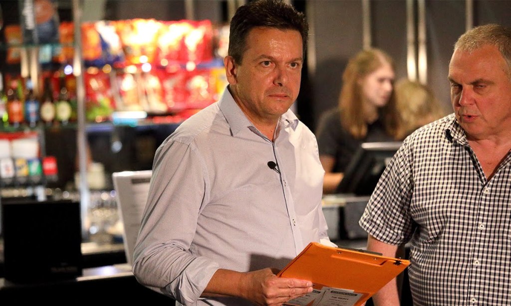 A grim Nick Xenophon, with senator and former campaign manager Stirling Griff, on election night. Photo: Tony Lewis / InDaily