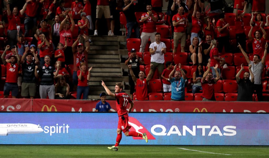 Johan Absalonsen of Adelaide United celebrates the Reds' fourth goal against the Jets. Photo: AAP/James Elsby