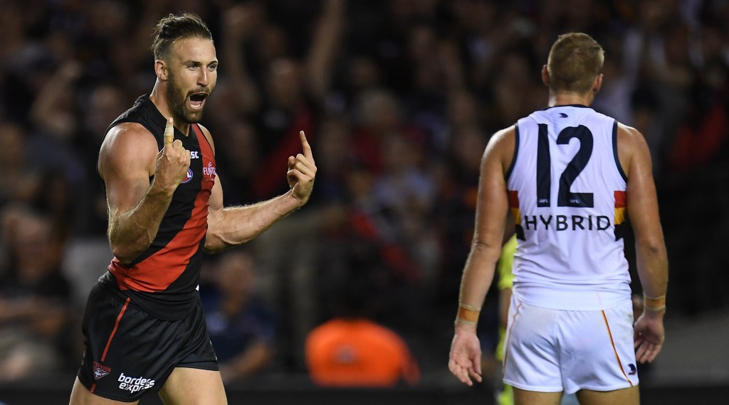 Daniel Talia prepares to have his hair playfully ruffled by a gleeful Cale Hooker. Photo: Julian Smith / AAP