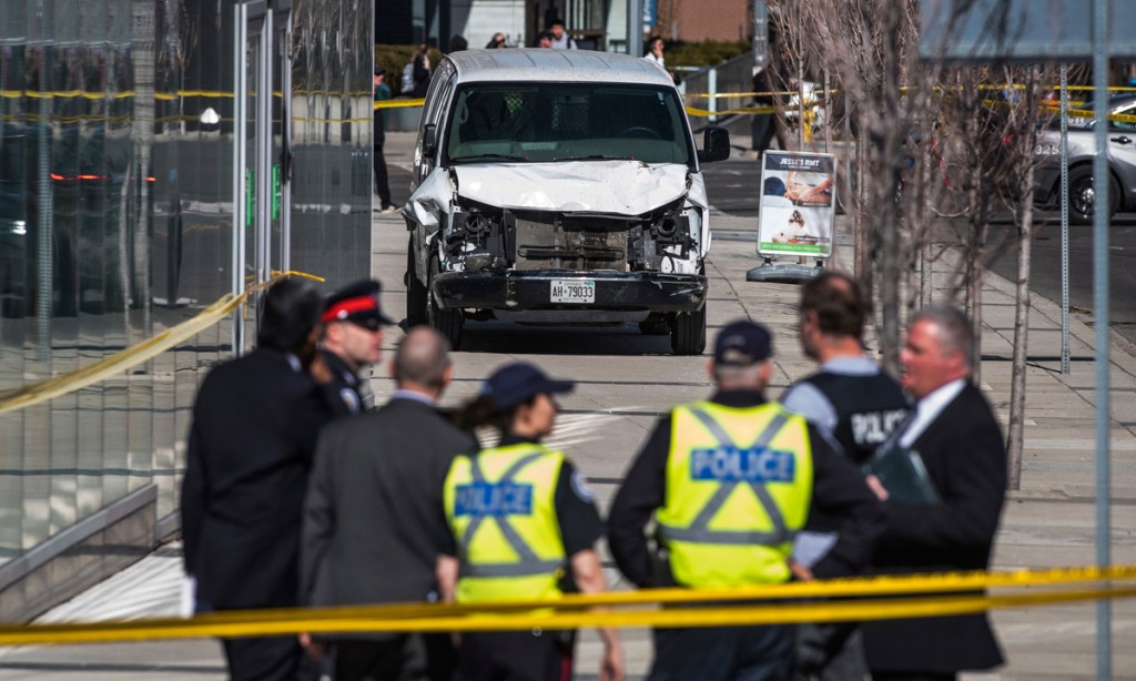 Police near the scene of the tragedy in Toronto. Photo: AP