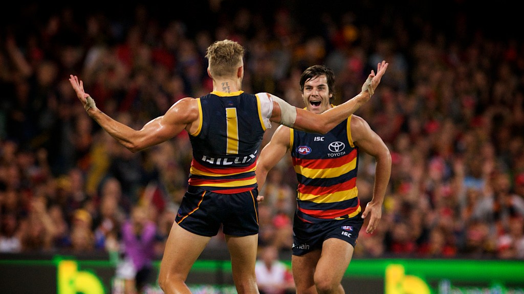 "My goal was THIS BIG!" Hugh Greenwood and Darcy Fogarty celebrate during the Crows' Grand Final (Rematch) win. Photo: Michael Errey / InDaily