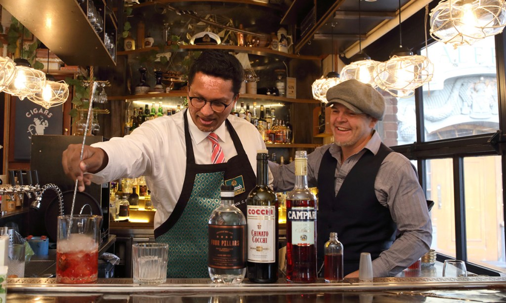 Dilhan C Fernando blends a tea cocktail with Hains & Co owner Marcus Motteram. Photo: Tony Lewis / InDaily
