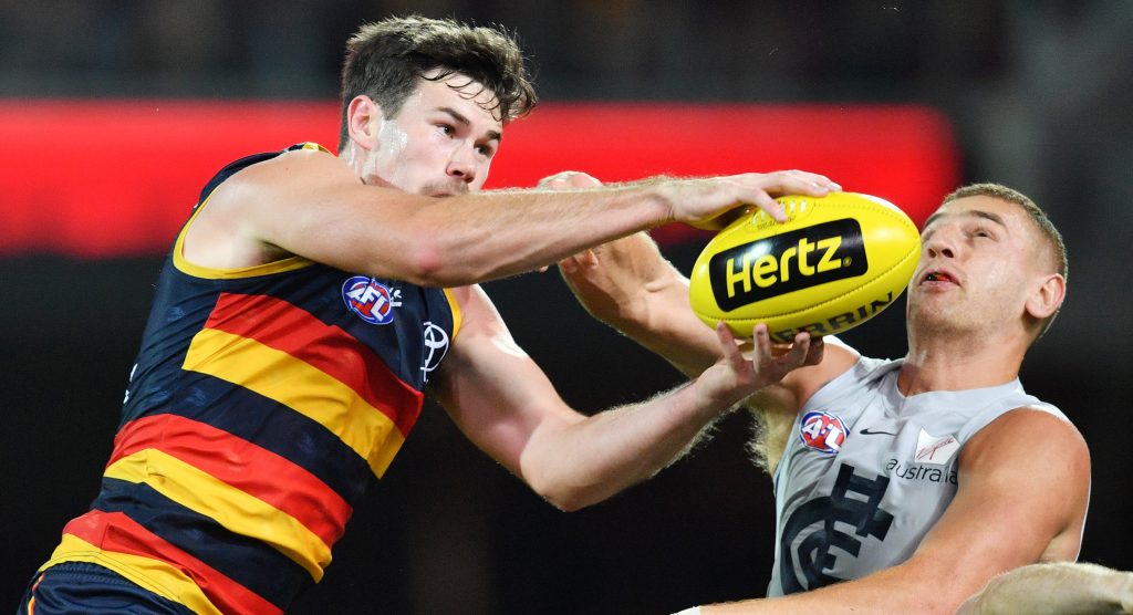 Mitch McGovern outmarks Liam Jones during Adelaide's comfortable win over Carlton. Photo: David Mariuz / AAP