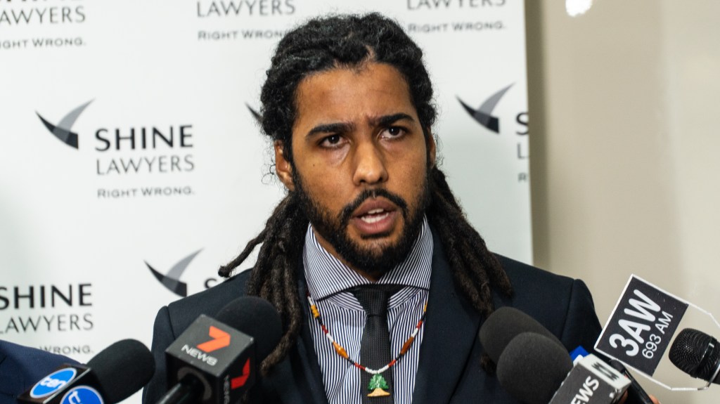 Former AFL player Joel Wilkinson during a press conference at the office of his Melbourne lawyers today. Photo: AAP/Andrew Leeson