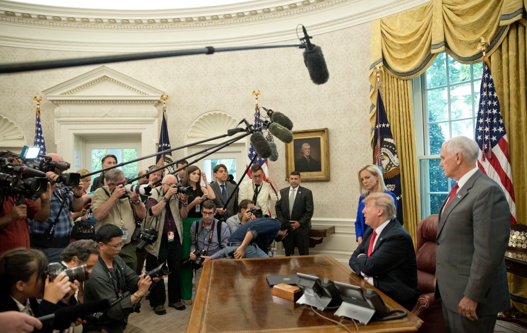 President Donald Trump  after signing an executive order to end family separations. Standing with him are Homeland Security Secretary Kirstjen Nielsen and Vice President Mike Pence. Photo: AP/Pablo Martinez Monsivais