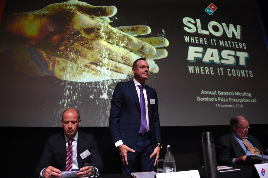 Domino's Pizza CEO Don Meij (standing) topped ACSI's list of the highest-paid CEOs for 2017. Photo: AAP/Dan Peled