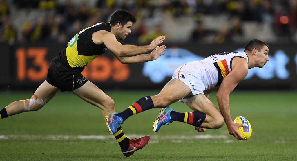 Trent Cotchin and Tex Walker provide a striking impression of the weekend's game. Photo: Julian Smith / AAP
