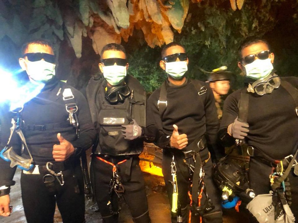 Success: The four last Thai Navy SEALS members, who stayed with the youth soccer team and their assistant coach inside a cave until they all were rescued. Photo: EPA/Royal Thai Navy