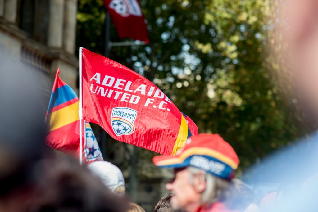 ADELAIDE UNITES: Fans take to the streets to celebrate the club's premiership/championship double in 2016. Photo: Nat Rogers / InDaily